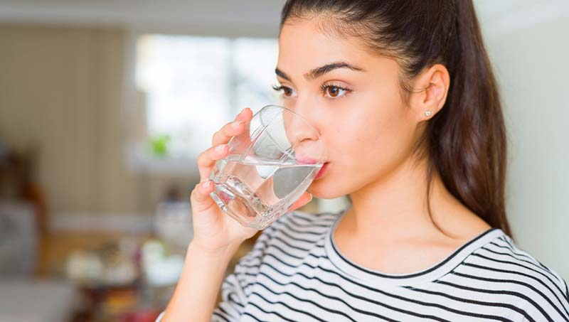 patient drinking more water following the advice of a San Jose acupuncturist at Eternal Health & Wellness Acupuncture Center